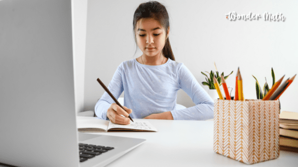 Young girl learning with a computer